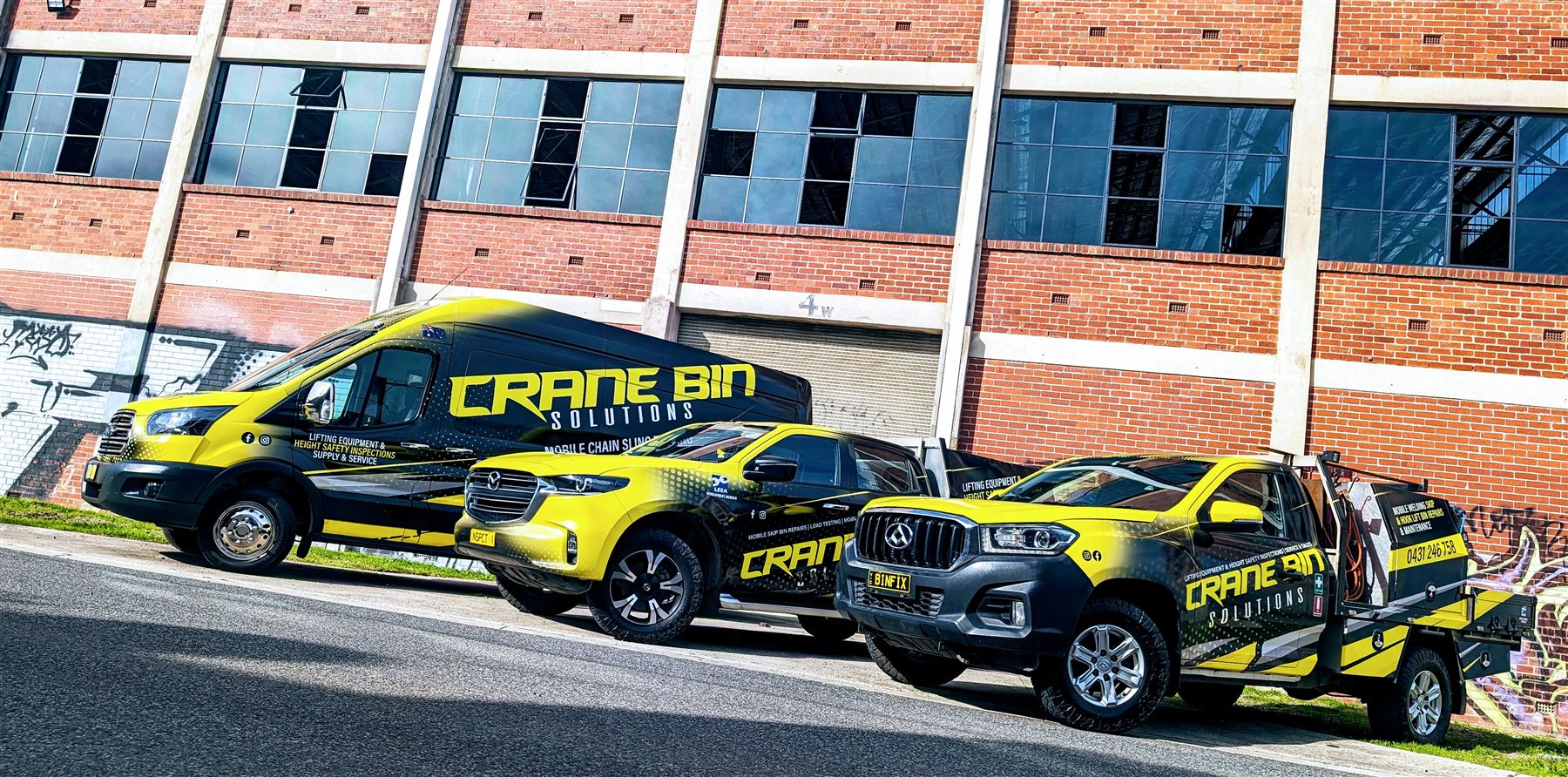 Crane Bin Solutions branded fleet — van and utes